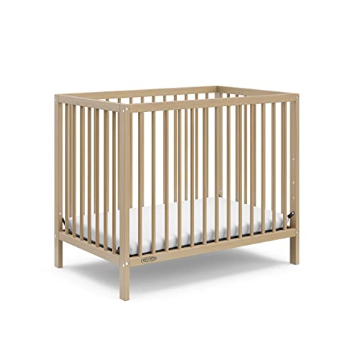 Graco Teddi 4-in-1 Convertible Mini Crib with Bonus Water-Resistant Mattress (Driftwood) – GREENGUARD Gold Certified, 2.75-Inch Mattress Included, Ideal for Small Spaces, Easy 30-Minute Assembly
